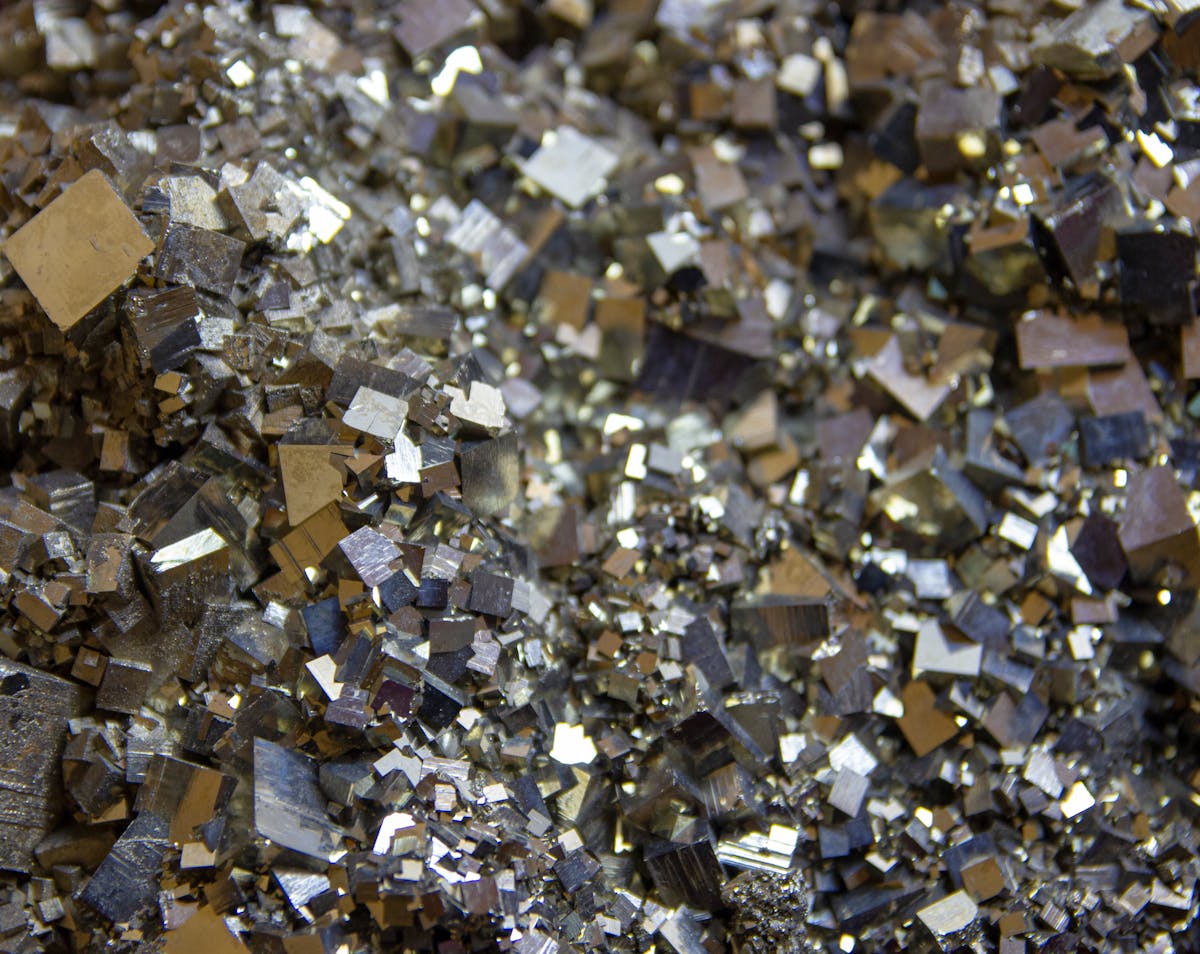 Iron pyrite mineral crystals close-up dark moody photo for iron free multivitamin post